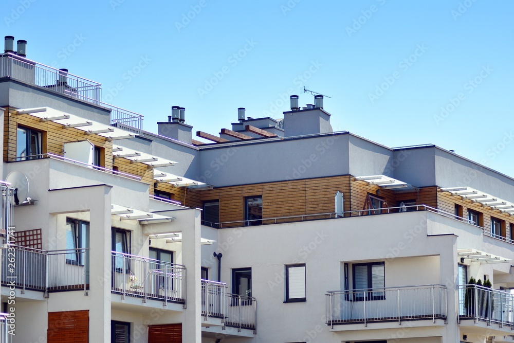 Modern apartment buildings on a sunny day with a blue sky. Facade of a modern apartment building