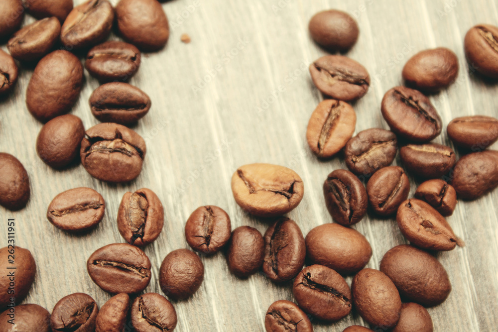coffee beans on wooden background. view from above. coffee beans on wooden background. view from above.