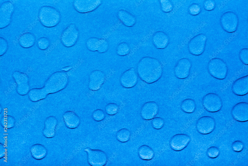 Drops of water on a blue smooth surface. Top view Drops of water on a blue smooth surface. Top view