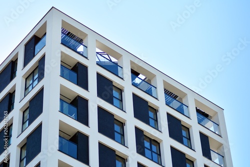 Modern apartment buildings on a sunny day with a blue sky. Facade of a modern apartment building