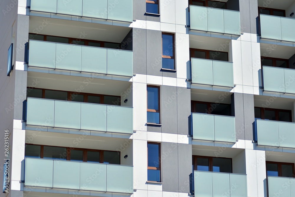 Modern apartment buildings on a sunny day with a blue sky. Facade of a modern apartment building