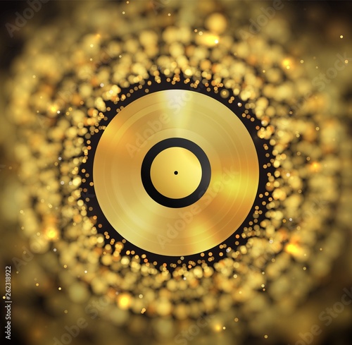 Golden vinyl disc on abstract golden blurred background. Music disco abstract blur effect