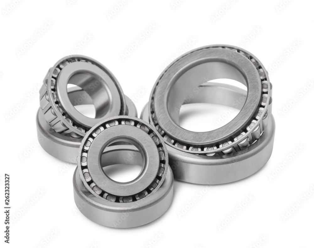 Three automotive roller bearings isolated on white background.