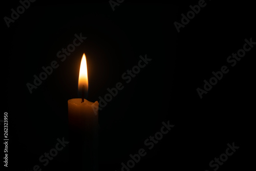 Candle flame in black background