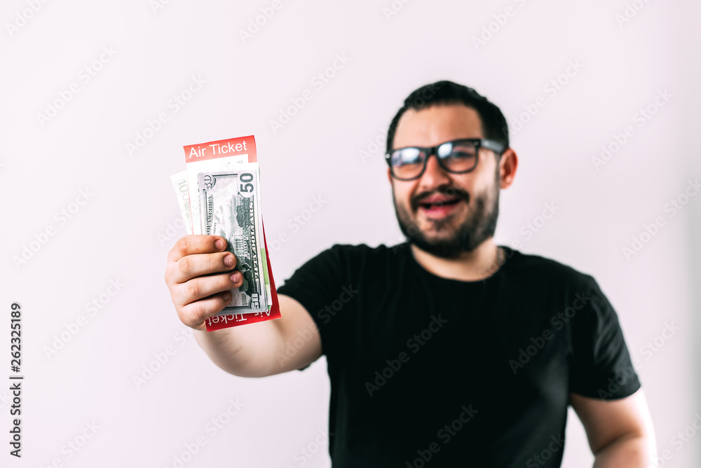 a man in glasses with air tickets and money is going to fly a man in glasses with air tickets and money is going to fly