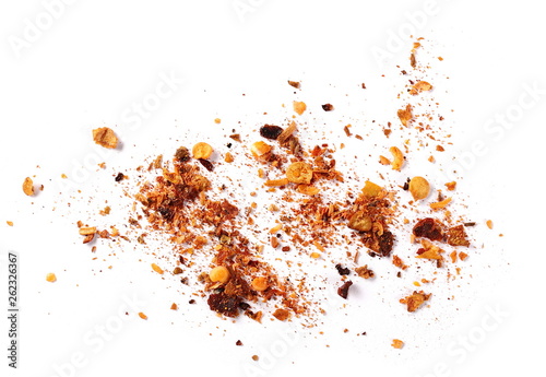 pile crushed red cayenne pepper, dried chili flakes and seeds isolated on white background, top view