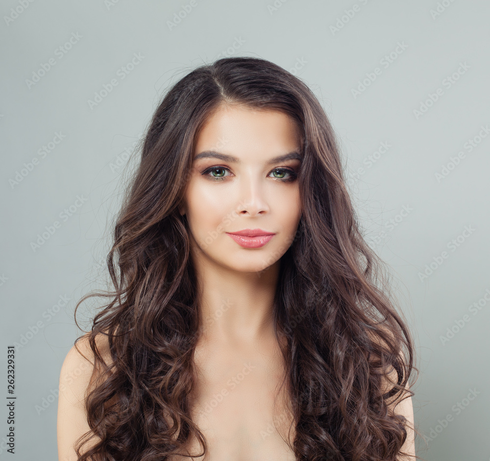 Brunette model woman with curly hair, portrait