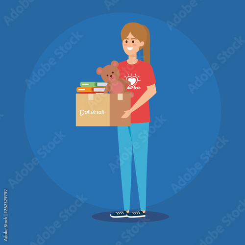 girl volunteer with box donation and teddy