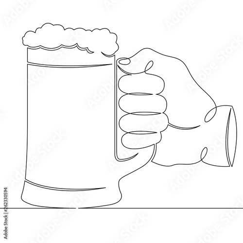 hand holding a glass mug with beer foam