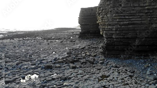 beautiful 4k reveal panorama of cliffs at beach 