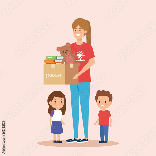 girl volunteer with box donation to kids