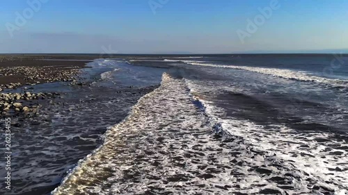 Beautiful 2.7k Drone Over British Coastline Calm Waves Sand and Sun
