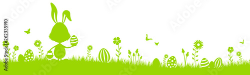 Frohe Ostern Silhouette grün mit Osterhase und Ostereiern auf Osterwiese