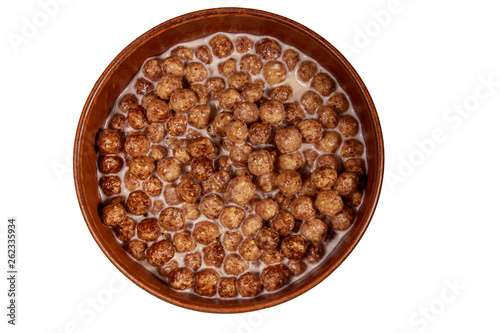Cereal chocolate balls with milk in a bowl isolated on white background