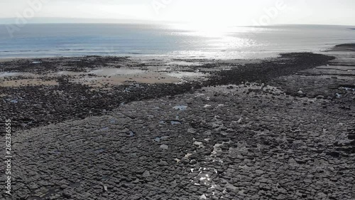 Beautiful 4k zoom over man's shoulder at the sunny beach 