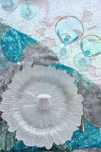 Seashell plate with pearl and blue glasses