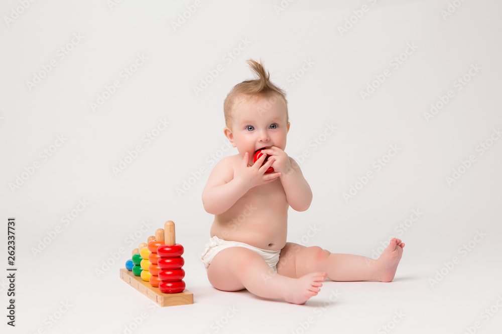 smiling kid girl playing with toy isolated on white background,baby girl 6 months old with wooden toy on white background,educational games for children smiling kid girl playing with toy isolated on white background,baby girl 6 months old with wooden toy on white background,educational games for children