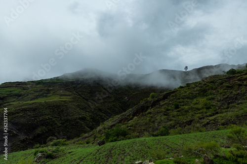 Landscape in Bolivia formed by mountains and white clouds © robertokenapp