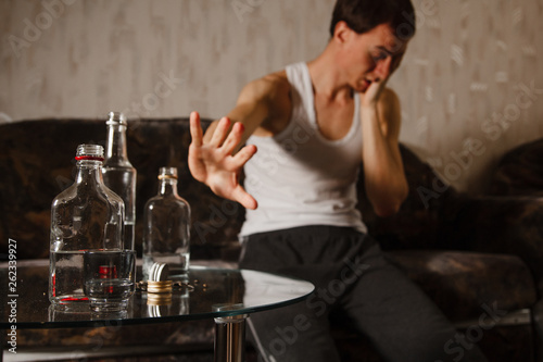 alcoholism problem. alcoholic guy. bad habit. social disease. harm to health photo