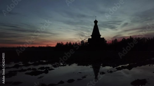 Silhouette of the temple in the name of the Icon of the Mother of God The Bogger of the microdistrict of the Lugovaya town of Lobnya, Moscow region. Sunset landscape photo