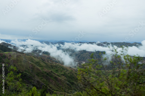 Landscape in Bolivia formed by mountains and white clouds