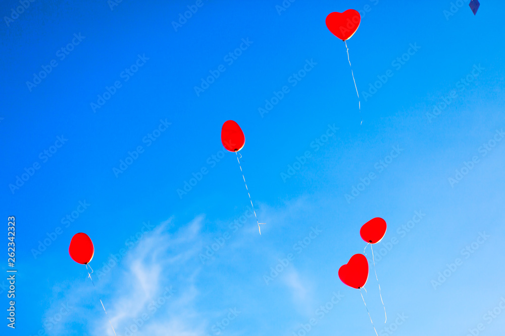 Heart Shaped Baloons over Blue Skye