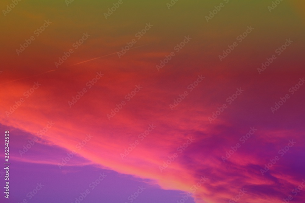 beautiful vivid sun colored partially cloudy sky for using in design as background.