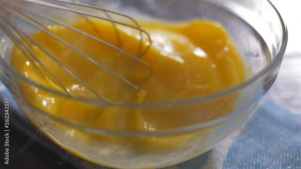 Beating of eggs in a bowl. Slow motion. Beating of eggs in a bowl. Slow motion.