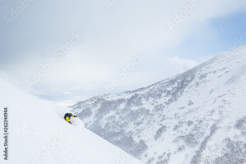 Backcountry skiing Hokkaido, Japan. Deep powder skiing in the wilderness near Niseko Mountain.