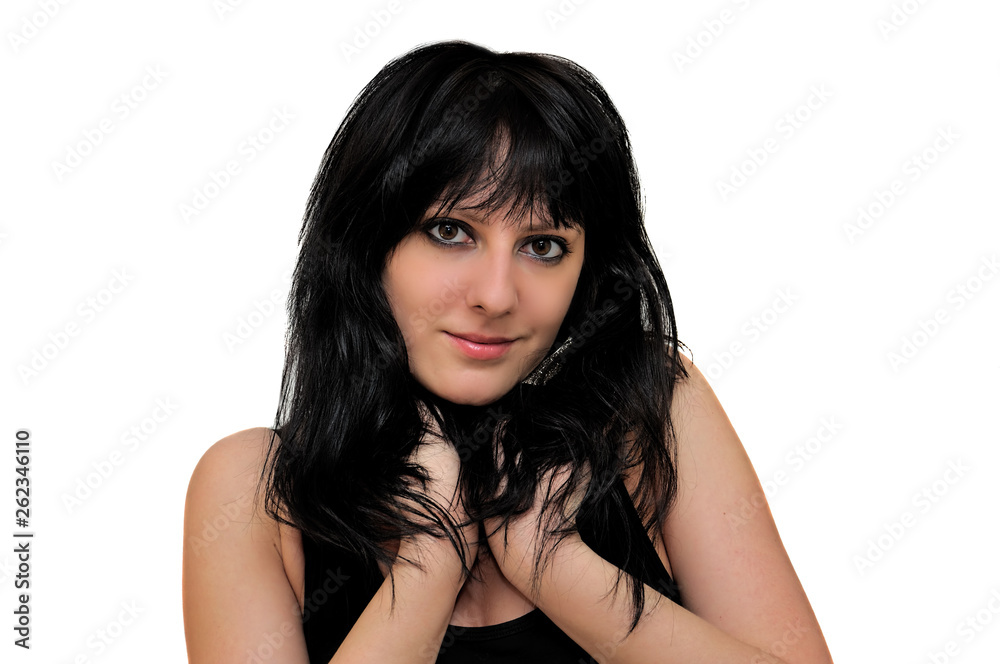 Naklejka premium Young brunette girl on a white background. Shoulder portrait.