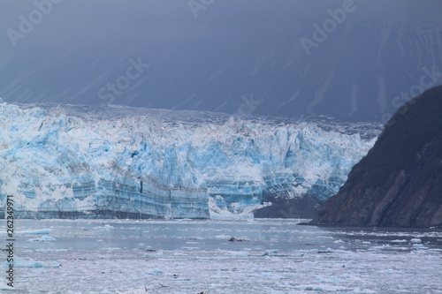 Hubbard Glacier showing growth layers and mountains in the background.