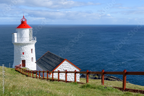 The lighthouse in Nolsoy island, Faroe Islands photo