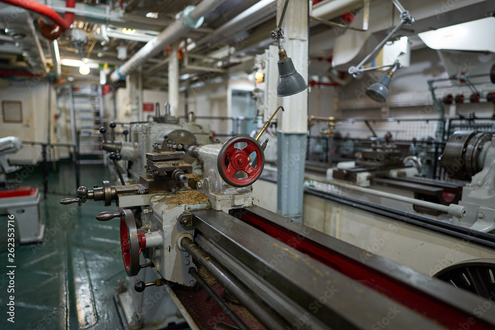 Lathe machine in lower deck of british war ship or cruiser HMS Belfast