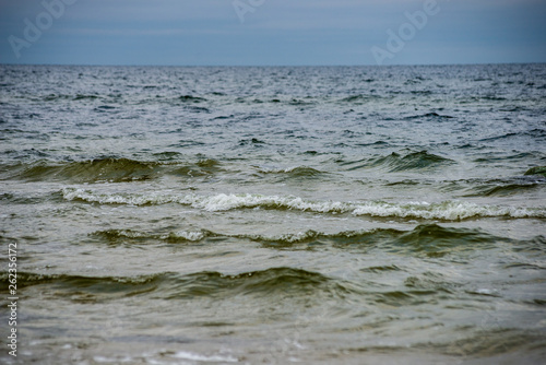 Fototapeta Naklejka Na Ścianę i Meble -  stormy sea beach with large rocks in the wet sand