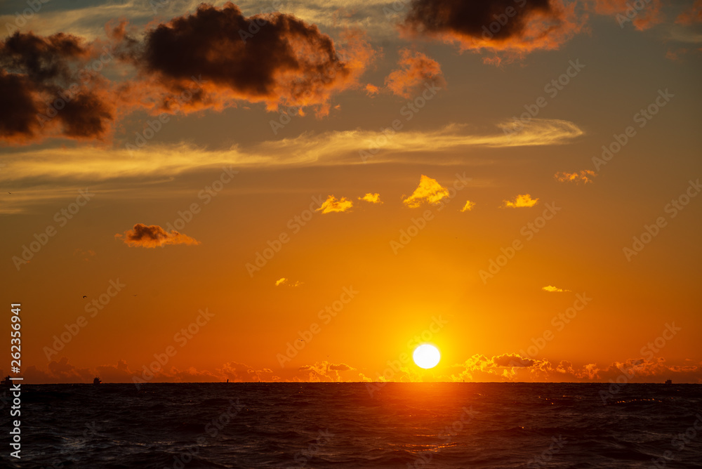 dark red sunset over sea in evening