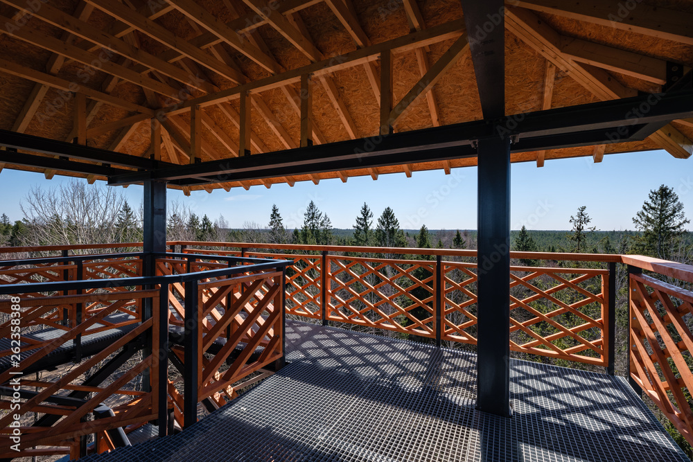 details of moder wooden and metal watchtower in forest