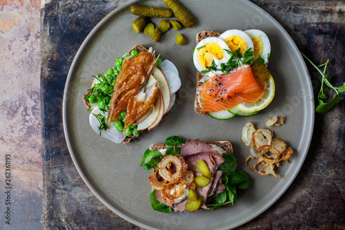 Scandinavian open sandwiches: beef, watercress and crisp onion, egg and salmon, smocked mackerel with crushed peas, fennel and apple