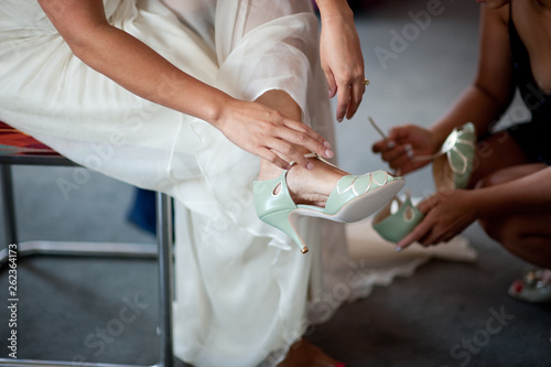 Bride Putting on Shoes