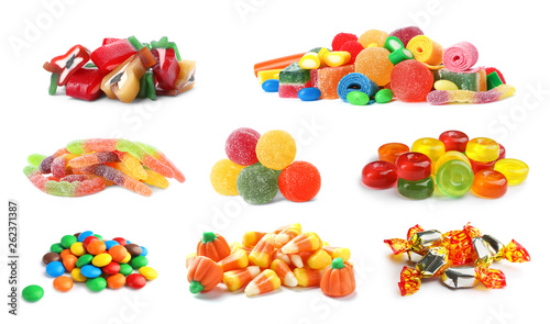 Set of different tasty candies on white background photo