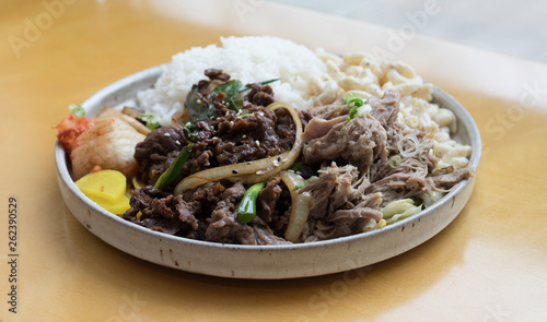 Hawaiian lunch plate with pork, beef, rice and vegetables served on a plate