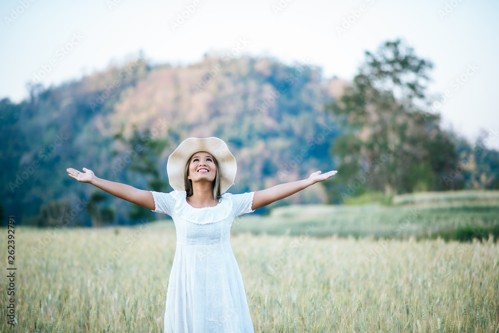 Woman in the hat happiness in the nature Woman in the hat happiness in the nature