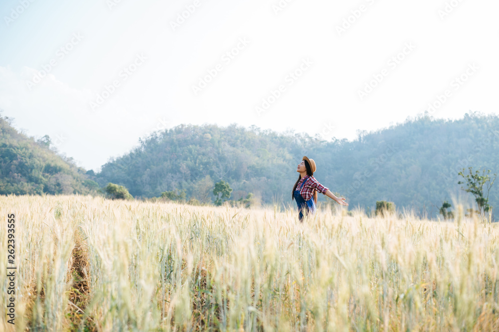 Woman farmer with barley field harvesting season Woman farmer with barley field harvesting season