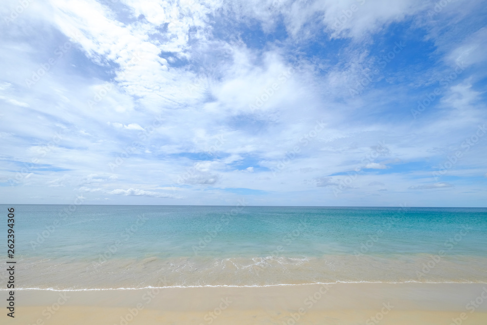 Calm and clear sea view of turquoise water on cloudy blue sky day
