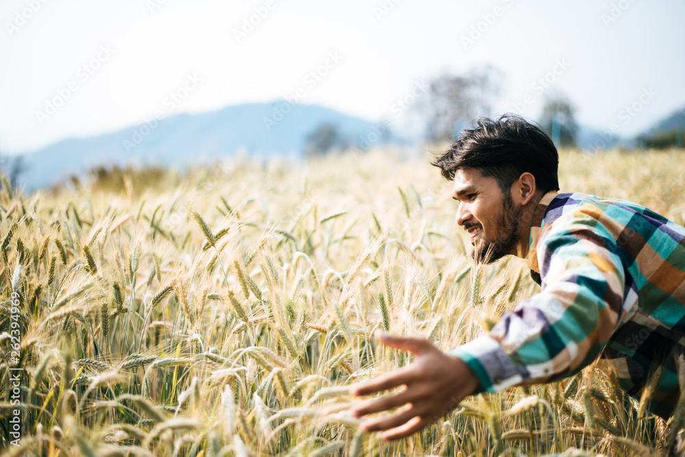 Handsome man farmer with barlay field Handsome man farmer with barlay field