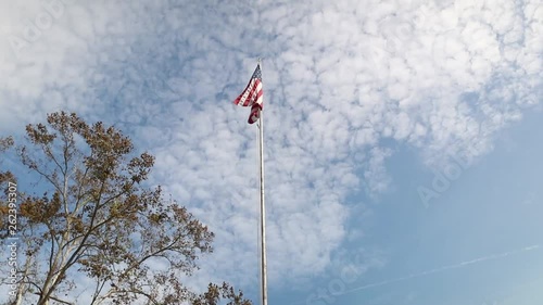 American Flag with a blue sky. 120p slow motion footage. photo