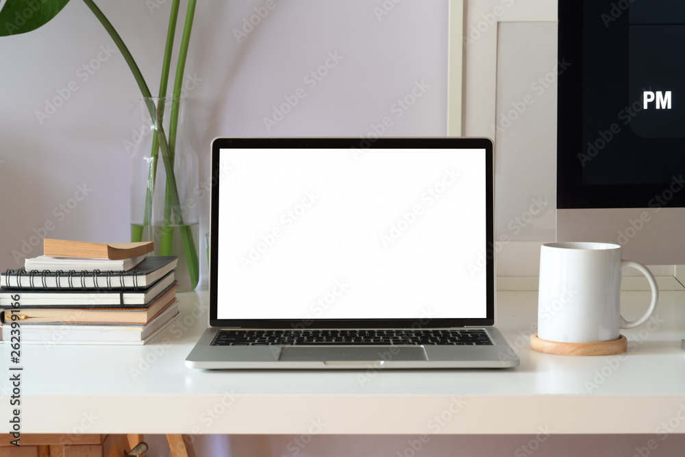 Fototapeta premium Mockup blank screen laptop on white workspace