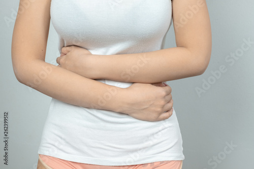 Wallpaper Mural Woman having painful stomachache.Chronic gastritis. .Women are menstrual period, causing abdominal pain. Torontodigital.ca