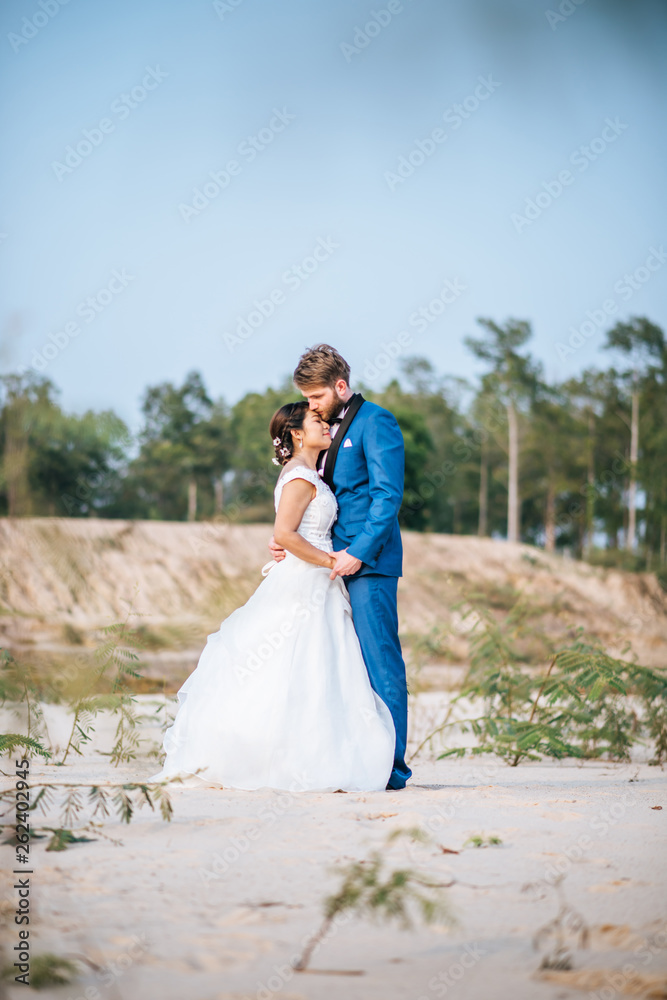 Asian bride and Caucasian groom have romance time and happy together Asian bride and Caucasian groom have romance time and happy together