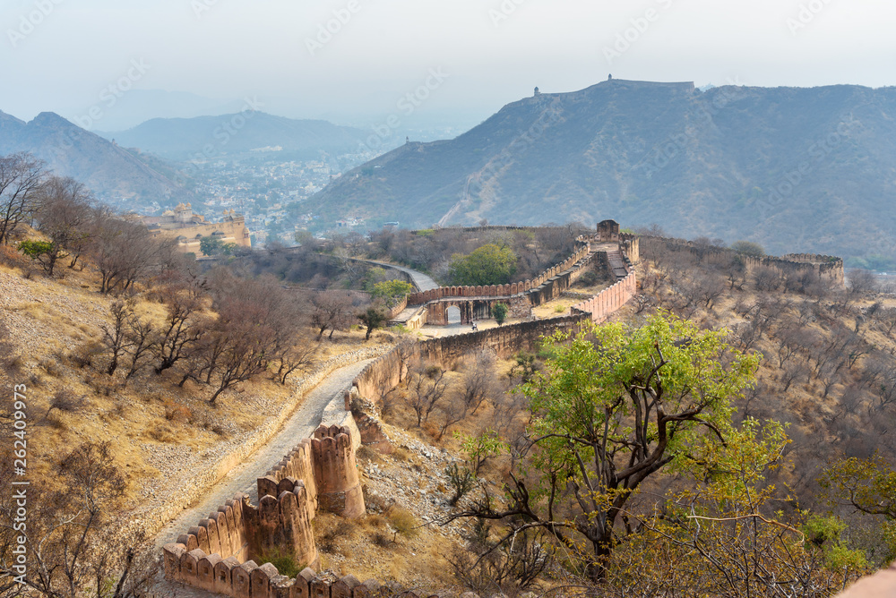 Fototapeta premium Ancient long wall with towers around Amber Fort. Rajasthan. India