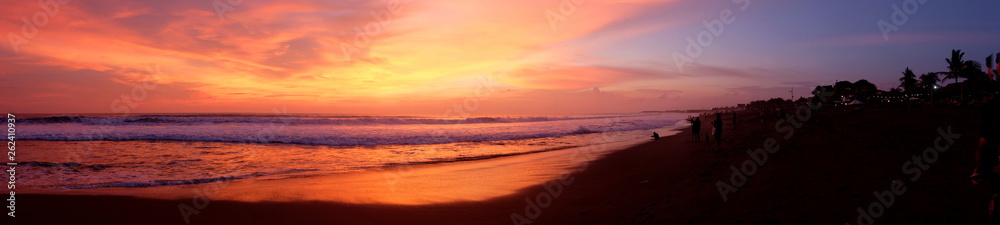 A panorama of the beautiful sunset at one of the beaches of Canggu, Bali, Indonesia